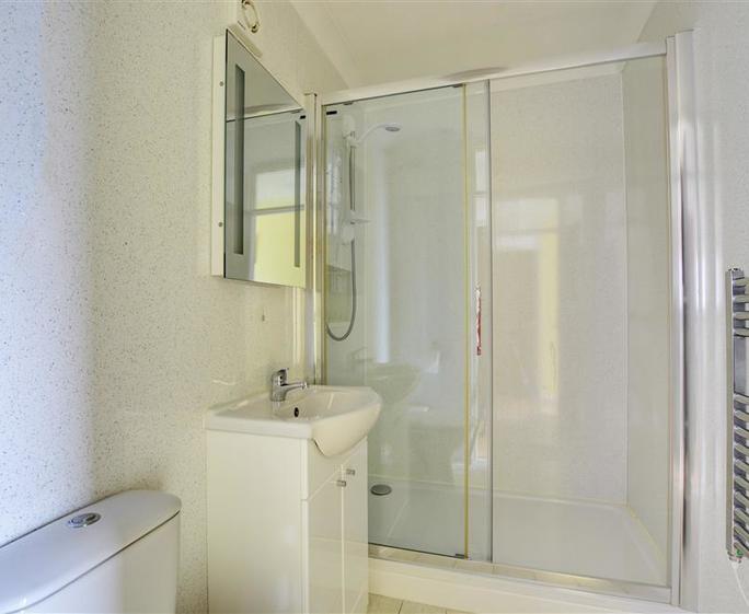 Spacious walk in shower.
