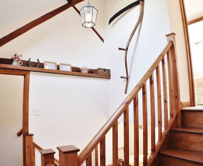 Stairway splits off to the two second floor sections
