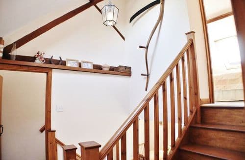 Stairway splits off to the two second floor sections