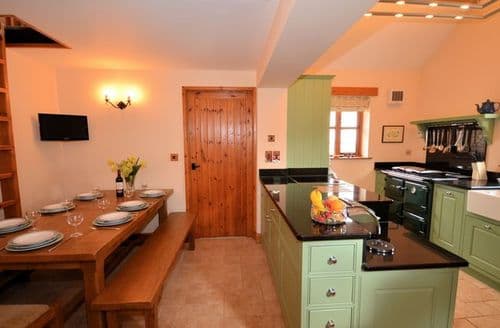 Kitchen/dining area showing access to single bedroomvia vertical ladder