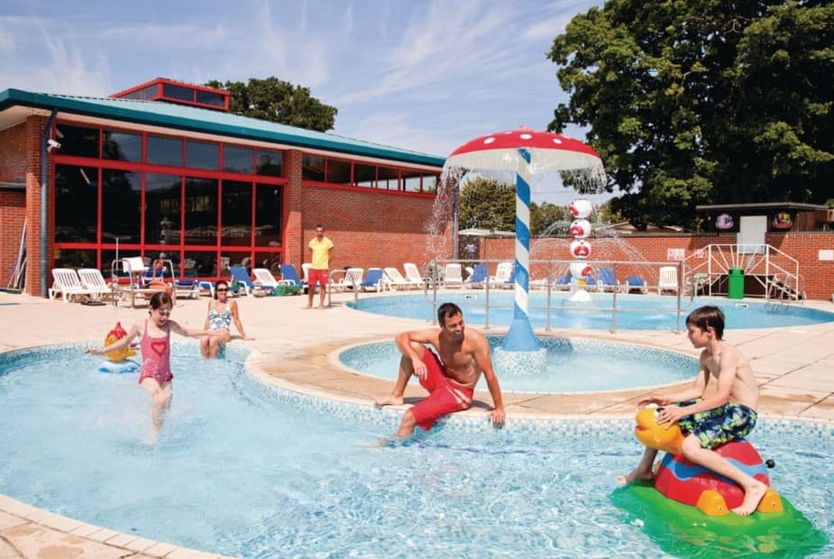 Outdoor swimming pool with water jets