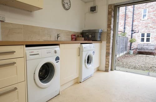 The utility room opens onto the patio