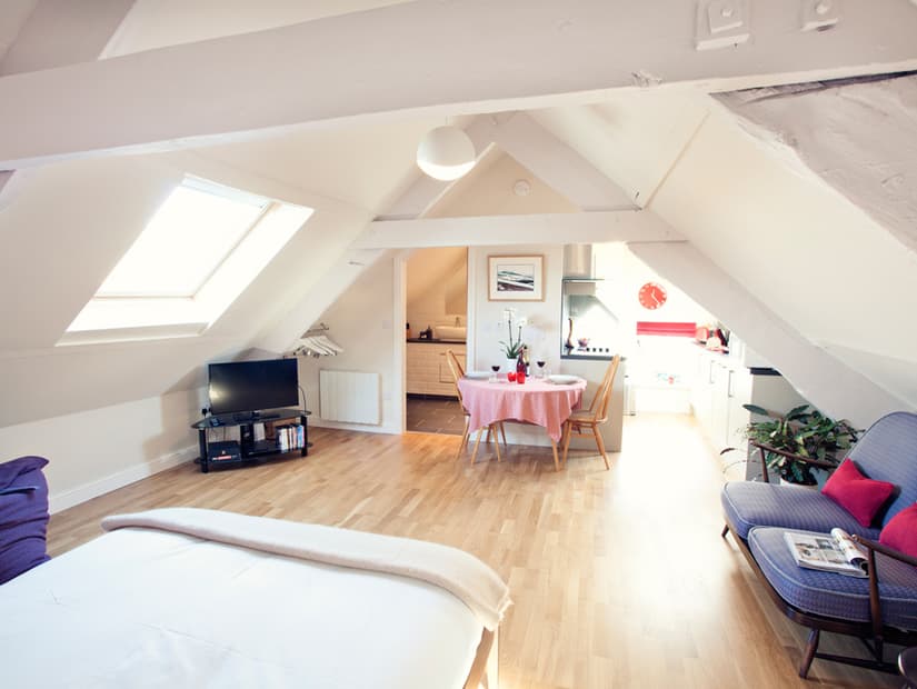 A self-contained king-size bedroom in the eaves of the house