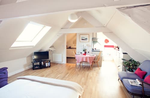 A self-contained king-size bedroom in the eaves of the house