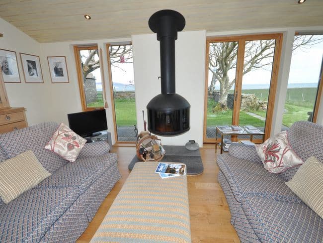 Lounge with cosy woodburner