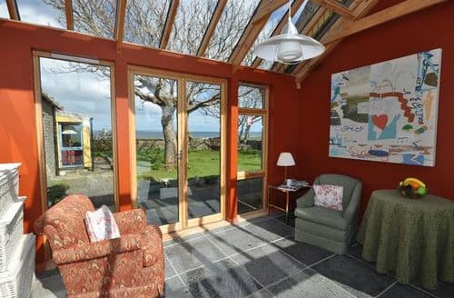 Conservatory with views and patio doors to garden