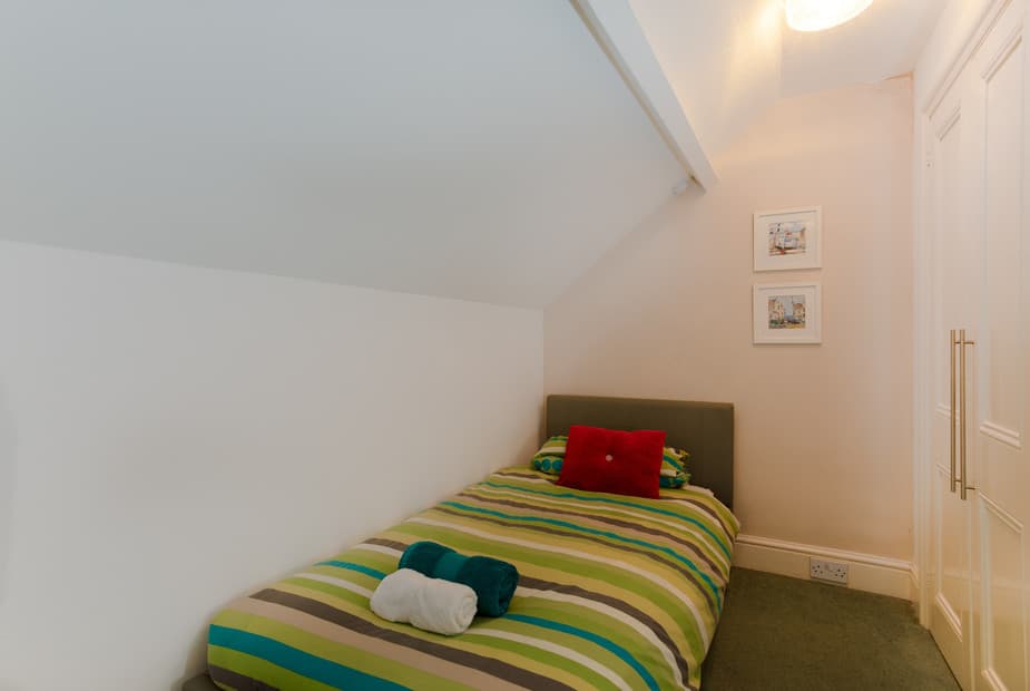 The single bed in the family room