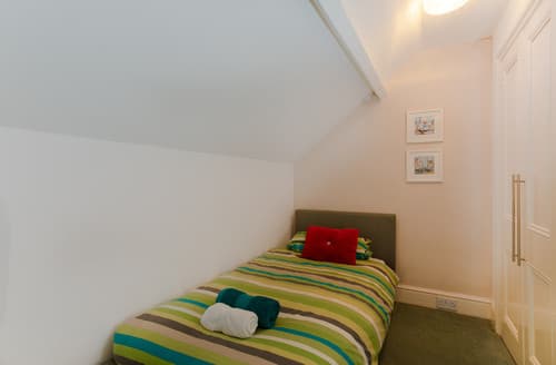 The single bed in the family room