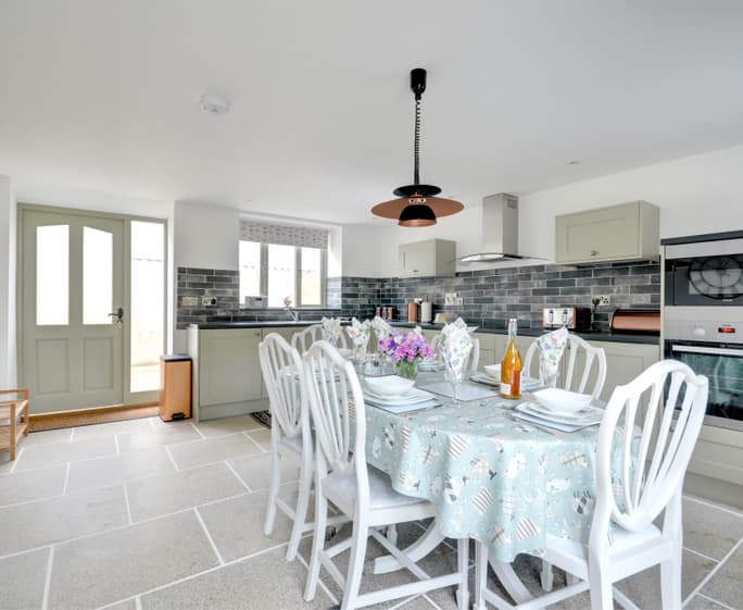 Entering the kitchen/dining area you immediately feel a welcome to this warm, light and spacious room