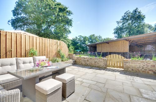 The spacious patio has very comfortable seating and a large table to enjoy al fresco dining