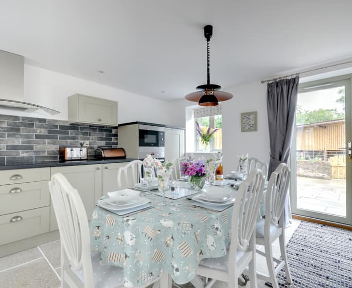 Entering the kitchen/dining area you immediately feel a welcome to this warm, light and spacious room