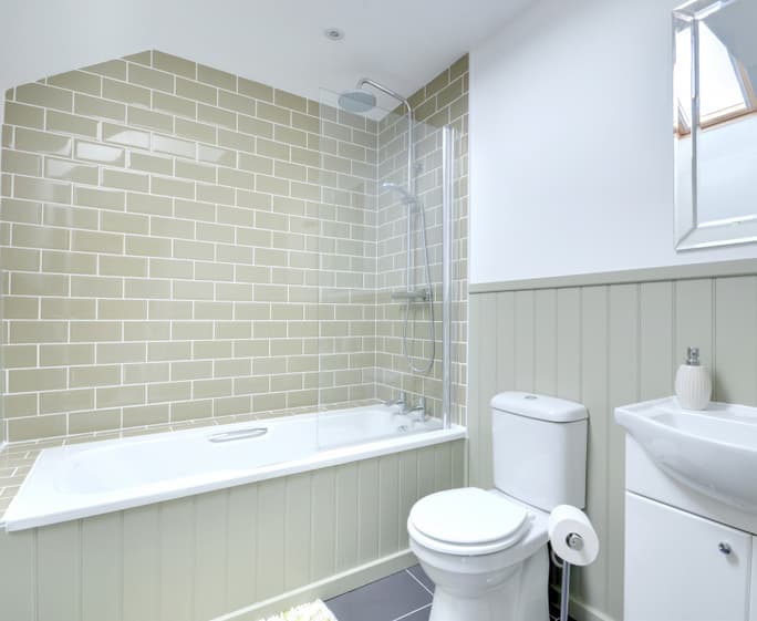 A stylish family bathroom with shower over bath