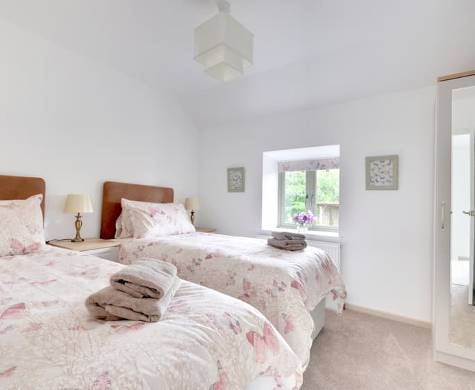 The pretty twin bedroom with countryside views