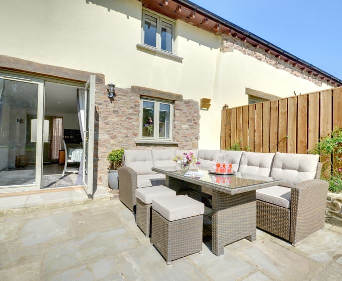 Outside you have your own private patio with barbecue, comfortable seating and large table ideal for balmy summer evenings