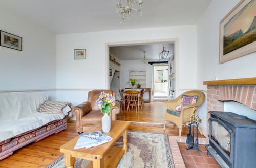 The log burning stove is flanked by comfy seating