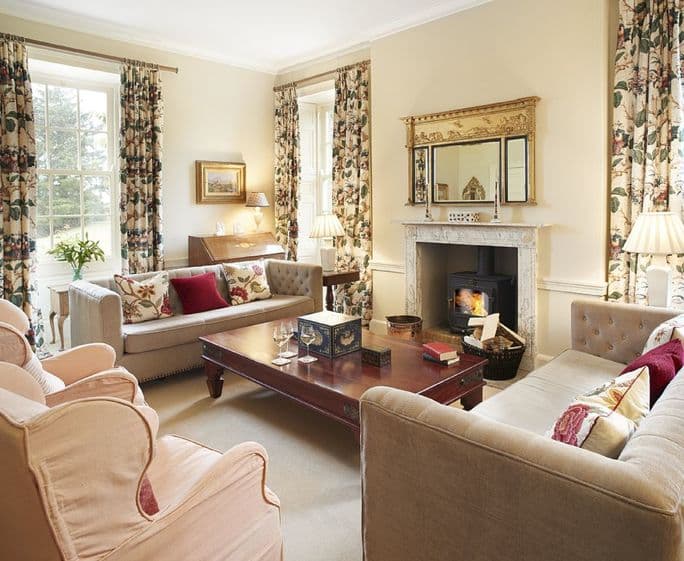 Ground floor: Drawing room with wood burning stove and garden views