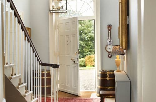 Ground floor: Spacious entrance hall with central staircase leading to first floor bedrooms and bathrooms