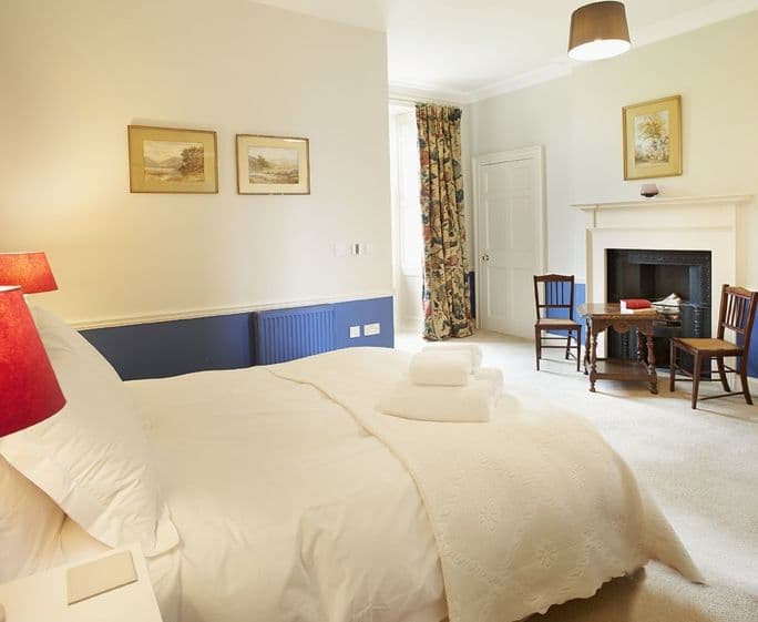 First floor: Bedroom four with king size bed and en-suite shower room
