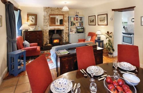 Ground floor:  Sitting room with wood burning stove and dining area