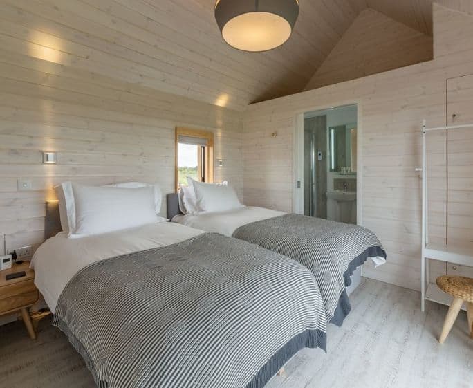 Super king zip and link beds, sea views and en suite with shower.