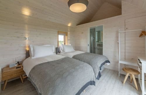 Super king zip and link beds, sea views and en suite with shower.