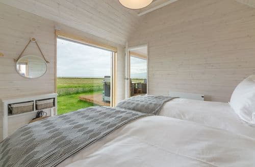 Super king zip and link beds, sea views and en suite with shower.