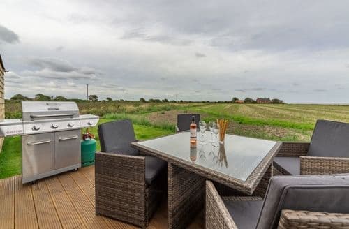 Decked terrace with garden furniture