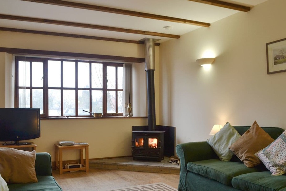The Granary - UK10686 Cosy living area with wood burner | The Granary - Upper Kingston Farm Cottages, Ringwood