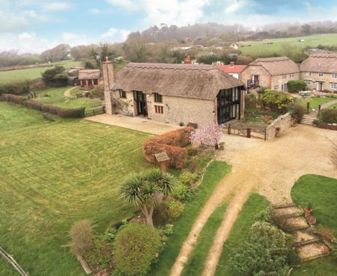 Champernhayes Barn, Wootton Fitzpaine, Nr Lyme Regis Champernhayes Barn is an impressive 15th Century barn that has been restored to original thatch and overlooks a beautiful valley with views of the Charmouth Sea