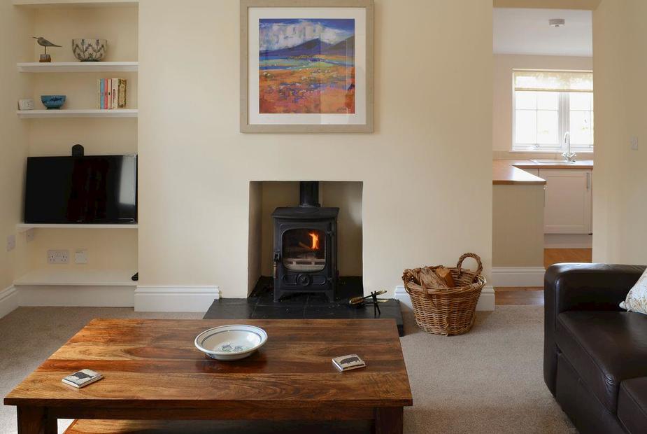 Maikle Cottage Comfortable lounge with wood burner and 32” Freeview TV | Maikle Cottage, Bonar Bridge, near Tain