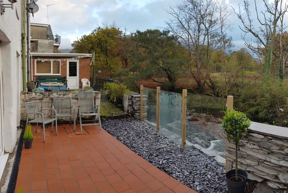 Glanafon Patio area overlooking the river | Glanafon, Bethesda, near Bangor