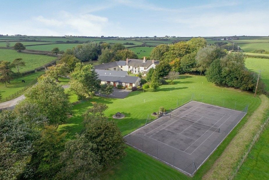 Honeysuckle Cottage - W8224 Aerial view of the 3 acres of meadows, lawns, tennis court, and putting course | Honey Suckle Cottage, Ashreigney, near Great Torrington