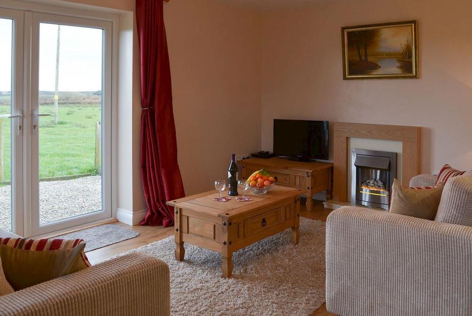 West View Cottage Living room with patio doors | West View Cottage, Woolley, near Bude