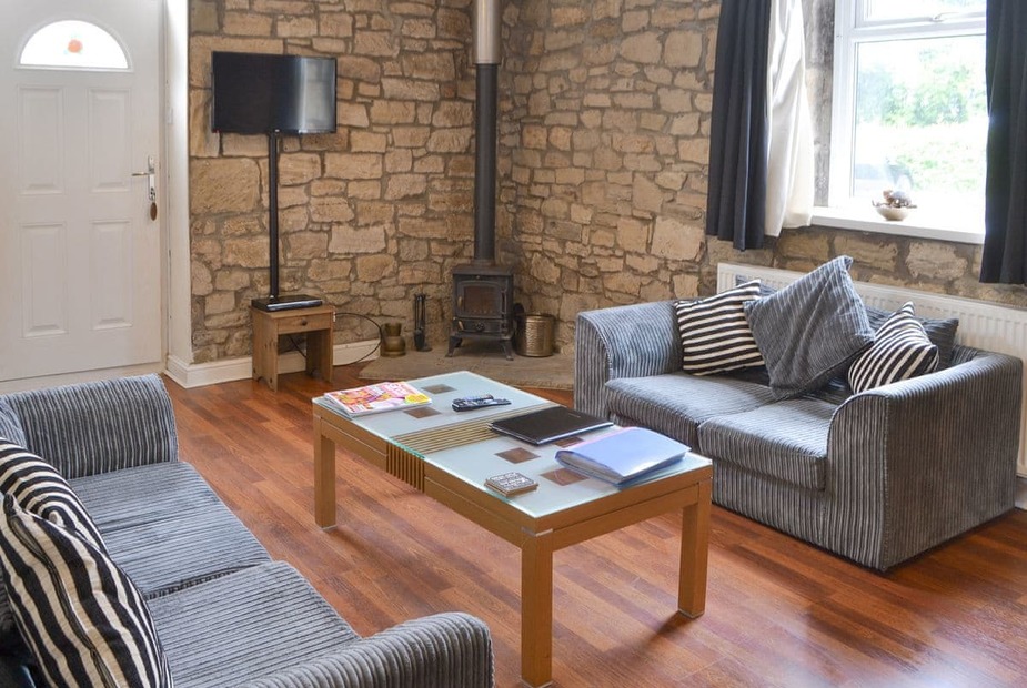 Stable Cottage Welcoming living area with wood burner | Stable Cottage - Railway Cottages, Acklington, near Amble