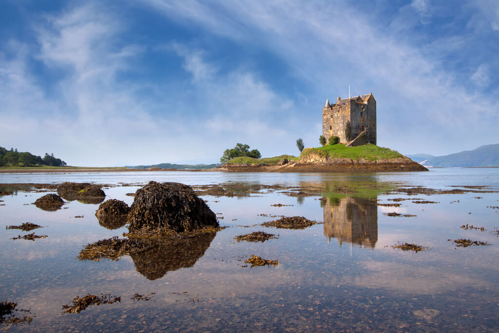 A view of a castle on a hill, one of the unmissable places to visit in Argyll and Bute