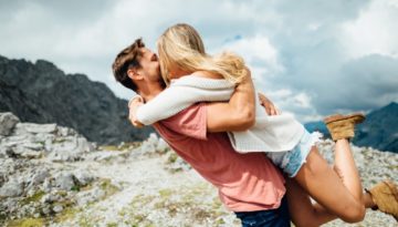 Places to take your girlfriend in the UK - a couple sharing a passionate kiss